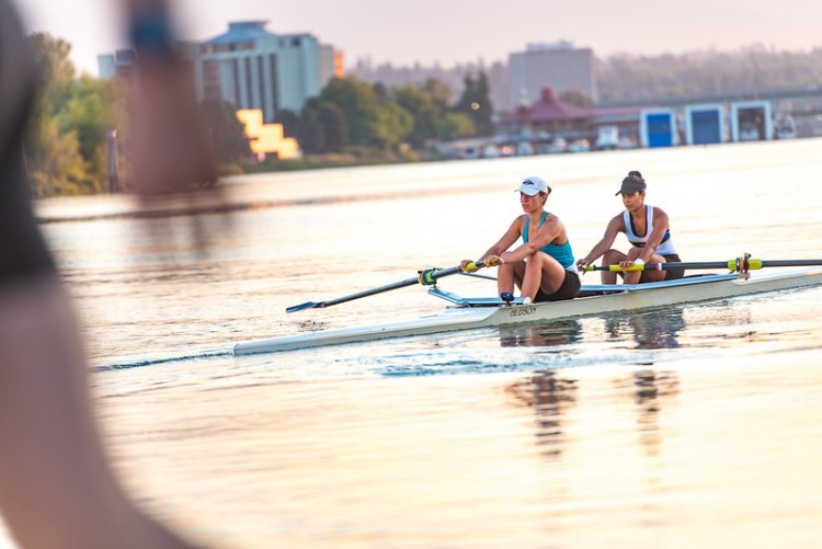 People rowing in a lake